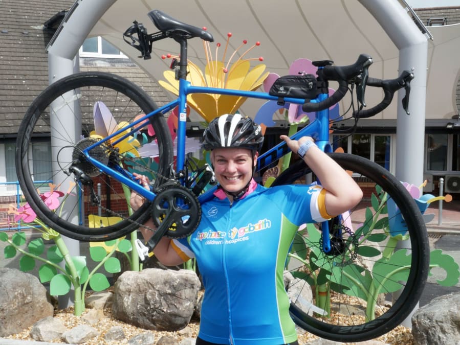 Jenny Coppock with bike at Hope House